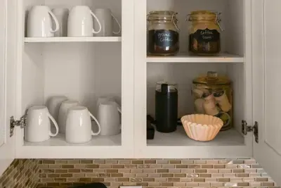 Morning essentials: Mugs and coffee neatly stocked in the kitchen drawer for your convenience