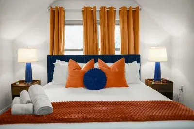 Bright and fluffy decor make this King bedroom a dream.