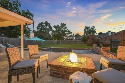The cozy poolside firepit creates a delightful scene during cool fall nights.