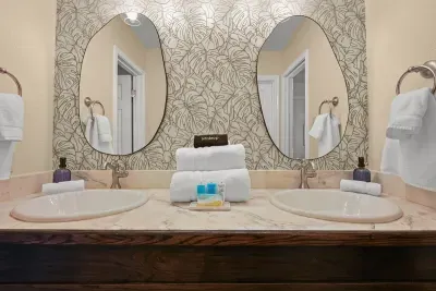 Thoughtful luxury: Dual mirrors and plush towels offer a perfect blend of style and comfort