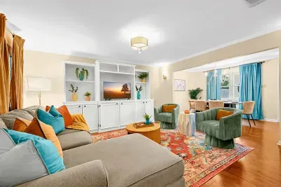 Sit back and watch your favorite movie or tv show in this vibrant living room.
