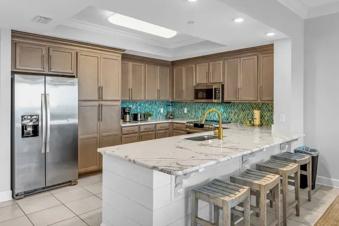 Cook a family meal in this fully equipped designer kitchen.