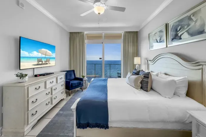 The master bedroom with its own balcony access and natural lighting.