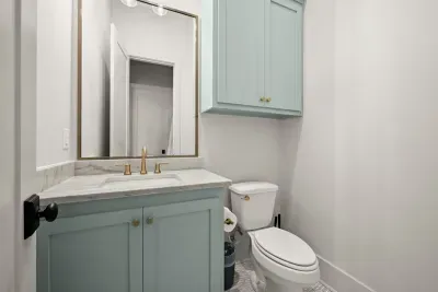 Elegant half bathroom with modern touches.