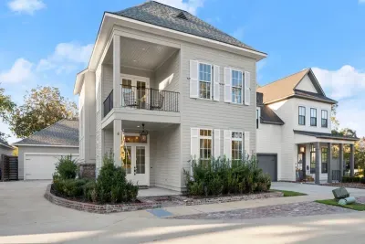 Charming modern home with Southern elegance—welcoming porch, balcony views, and plenty of space for your stay
