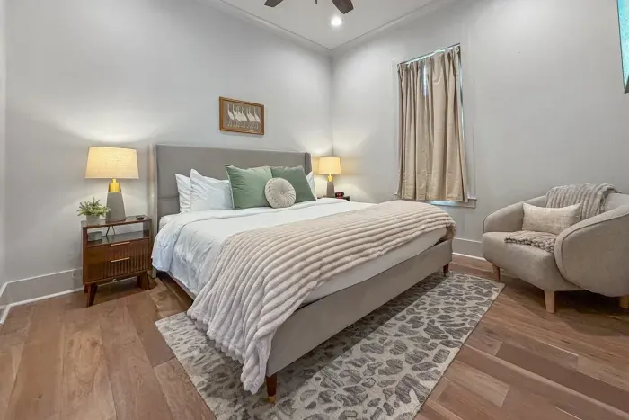 Stylish and serene bedroom with cozy touches, perfect for unwinding after a day of exploring