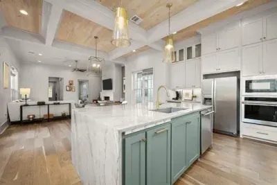 Waterfall granite countertops in the very modern and luxurious kitchen