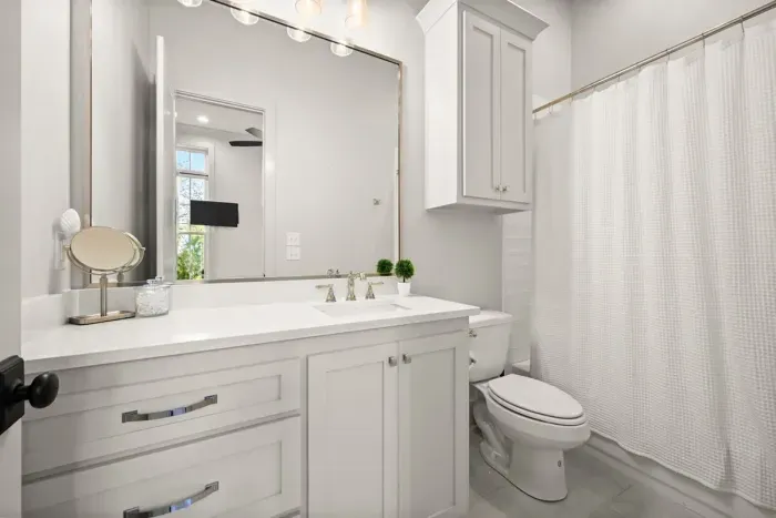 Enjoy getting ready with the ample lighting in this luxurious bathroom