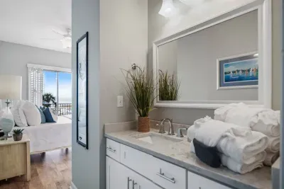 Adjoining master bath suite with plush hotel grade towels & linens.
