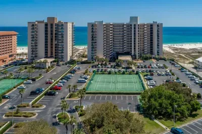 Tennis court and parking area.