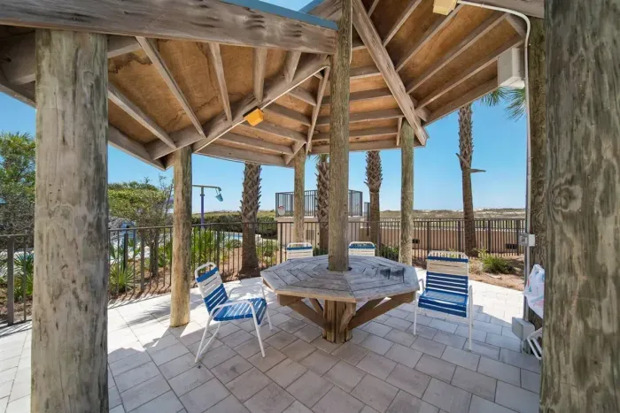 Gazebo between the splash pad & pool. Great spot to get out of the sun, watch the kiddos and chill from a direct balcony view!