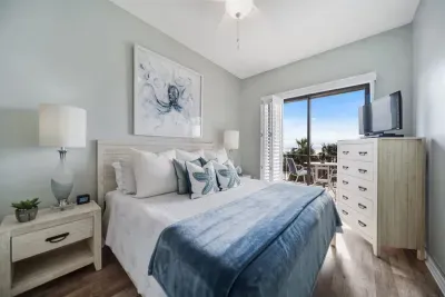 Direct views of the ocean, jetties and pool from master suite. Wake up & walk outside to watch boats go through the bay pass with morning coffee or, watch with a glass of wine for their sunset return.
