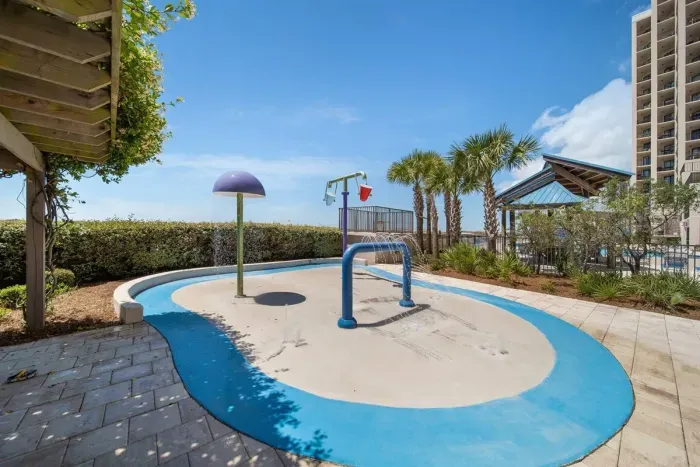 Splash pad and pergola directly in front of your condo.