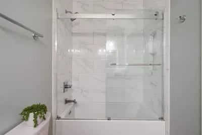 Designer guest bahtub and shower.