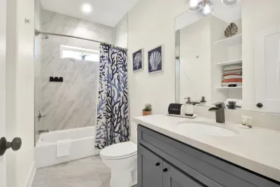 Super modern style bathroom with floor to ceiling marble shower.