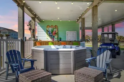 Enjoy relaxing in the hot tub for 8 with back massaging jets while your fur baby plays in the fenced in play area to the left!