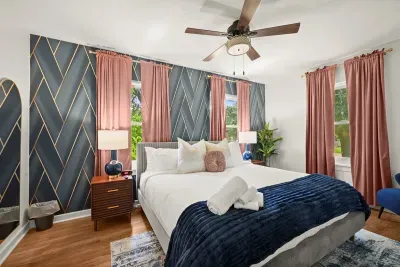 Chic Bedroom Retreat: Enjoy elegant decor and vibrant views in your restful Louisiana escape!