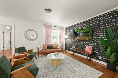 Living Room: Stylish design with chic decor, ample seating, and vibrant natural light awaits you!