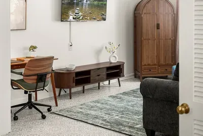 Living Room Retreat: Enjoy modern comforts with stylish decor and a cozy reading nook!