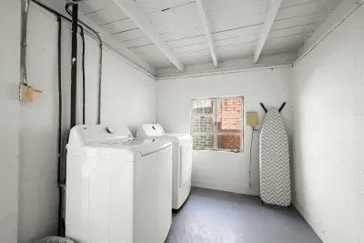 Laundry Room: Efficiently tackle your wash with modern machines and a bright, airy space!