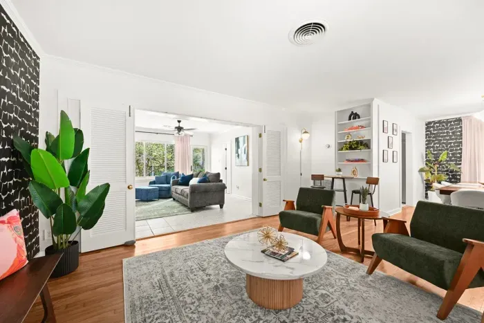 Living Room: Enjoy stylish comfort with vibrant decor and ample natural light! Perfect for gatherings.