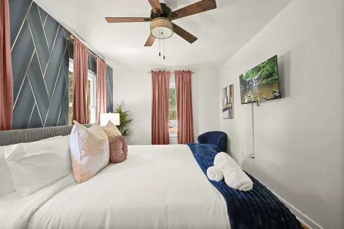 Chic Bedroom Retreat: Enjoy stylish decor, comfy linens, and sunny views for a perfect stay!