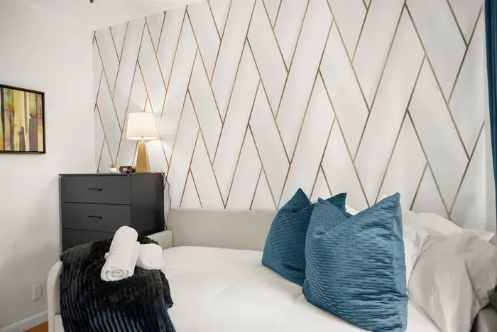 Charming Bedroom: Elegant decor, plush pillows, and a touch of Southern flair await your getaway!