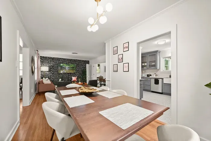Dining Room: Gather around the modern table for meals and laughter in this stylish space!