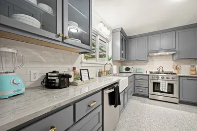Kitchen Delight: Modern appliances and chic decor make cooking a joy in this vibrant space!