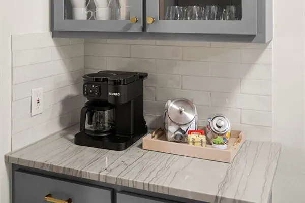 Coffee Corner: Brew and sip with style at this chic kitchenette, stocked and ready for your morning!