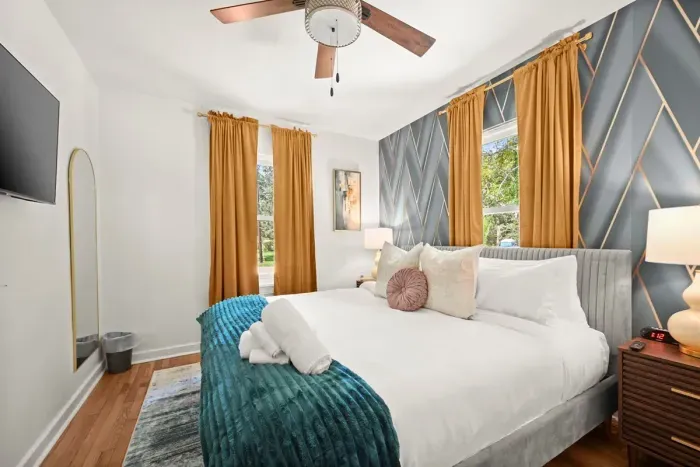 Bedroom Retreat: Vibrant decor, plush bedding, and scenic views for a dreamy escape!
