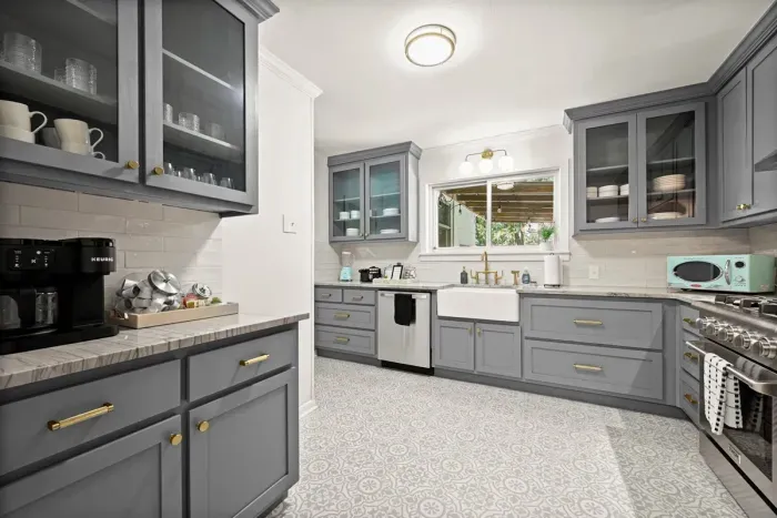 Kitchen Bliss: Stylish gray cabinetry and modern appliances create culinary inspiration!