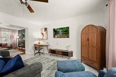 Living Room Retreat: Stylish seating, vibrant decor, and a perfect space to unwind after adventures!