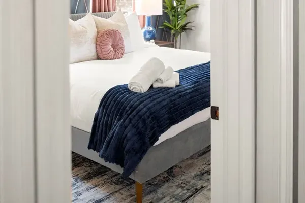 Bedroom Retreat: Relax in style with vibrant decor, plush bedding, and a touch of southern charm!