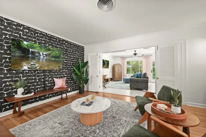 Living Room Retreat: Stylish space with bold decor, perfect for relaxation and entertainment!