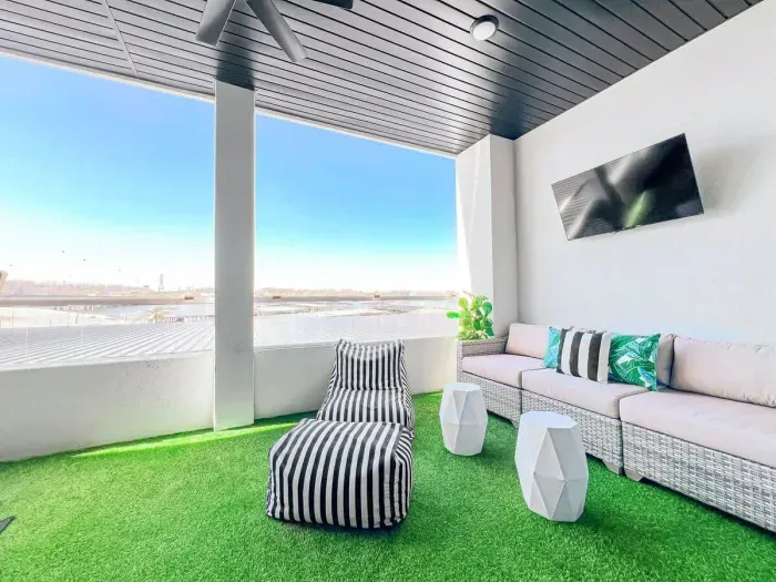 The back patio has the most lush feel with the turf under your feet and plush upscale seating. 