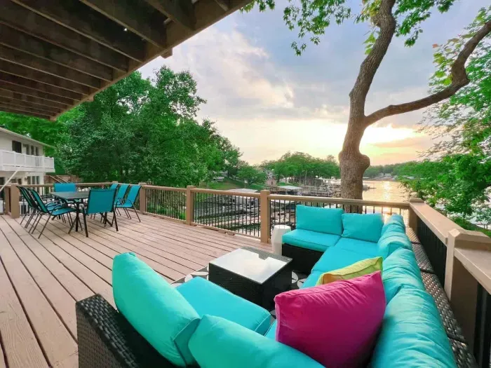 Lower level oversized deck with a gas grill, sofa sectional, dining table for 8 overlooking your own private dock just a few steps away & perfect views of the sunset reflecting off of the waters of Lake Ozark! **Please bring your own propane**