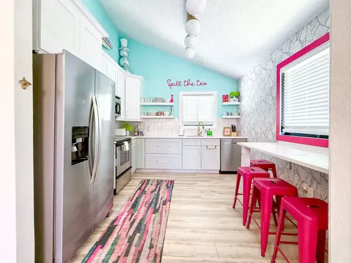 Alternate view of the stocked kitchen w/Quartz countertop & bar seating. The kitchen is open to the living & dining room for an open concept feel with views to the lake!
