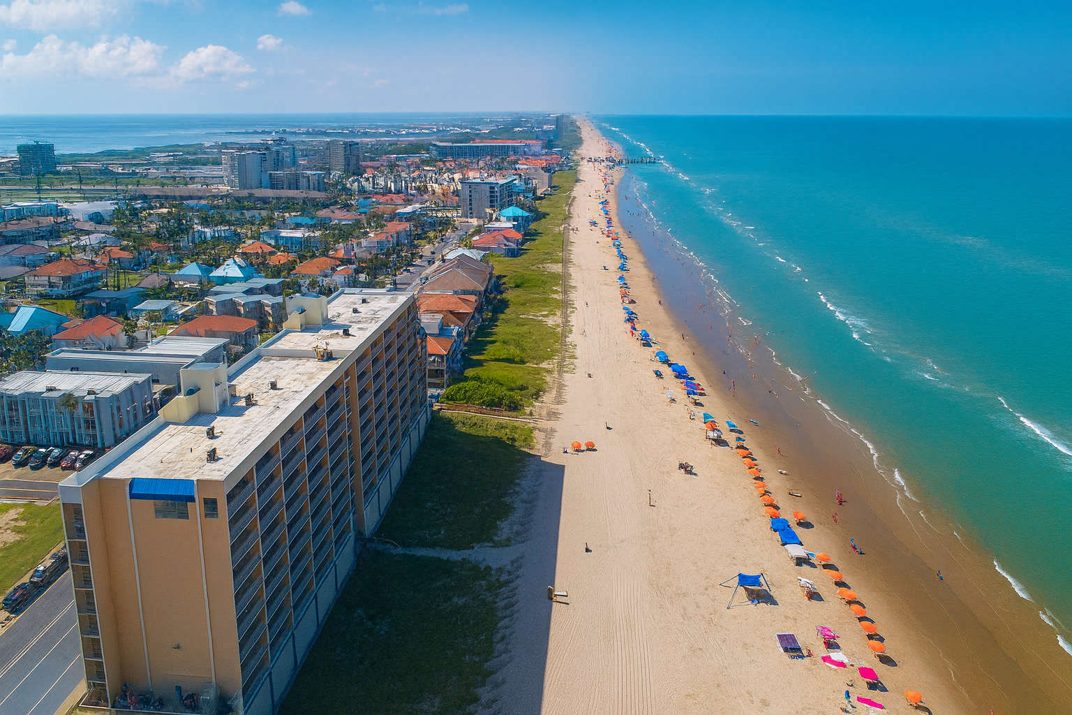 Prime Beachfront Condo Aerial Panorama
Elevate your stay in this oceanfront high-rise condo, steps from golden sands and vibrant boardwalk. Aerial views showcase endless blue waters, colorful umbrellas dotting the beach, and lively coastal skyline.