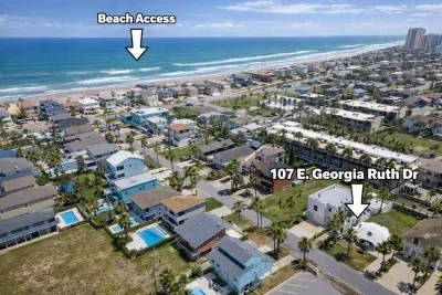 Beachside elegance meets effortless access — this South Padre Island retreat at 107 E. Georgia Ruth Dr offers a pool, palm‑lined serenity and direct beach access steps away. Ideal for families or groups seeking coastal luxury convenience.
