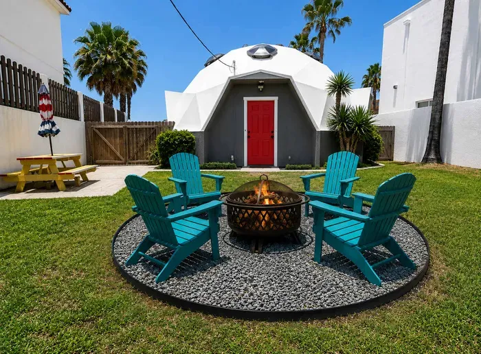 A cozy outdoor spot with a relaxed, playful vibe, where simple seating and open sky create an easy place to unwind. The calm setting brings a sense of escape and makes gathering, chatting, or just slowing down feel natural and unforced.