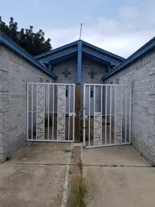 Funky older gates but it does lock and adds security / safety as this street can be busy