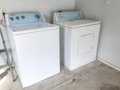 Washer and dryer set in a tidy utility space, giving guests convenient in‑home laundry access for longer stays and effortless day‑to‑day comfort.