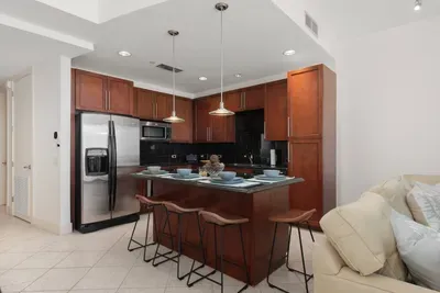 A warm, open kitchen space with simple styling, natural tones, and an easy flow that feels relaxed and welcoming. The clean layout and calm atmosphere make it a comfortable spot to gather, share meals, and enjoy unhurried moments throughout the stay.