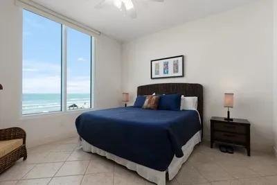 A calm, coastal bedroom with soft tones, natural light, and a simple layout that feels instantly welcoming. The relaxed styling and gentle details create an easy, unhurried atmosphere, offering a comfortable place to settle in & enjoy quiet moments.