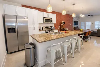 Warm, inviting kitchen where modern design meets effortless comfort — a space that feels instantly familiar yet distinctly refined. Perfect for gathering, cooking, or simply unwinding in style after a day of coastal adventure.