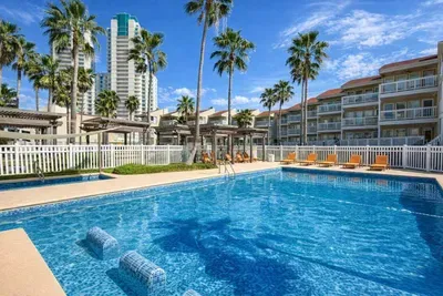 Resort‑Style Pool Retreat • Modern Complex • Palm‑View Lounging • Steps to Beaches & Dining