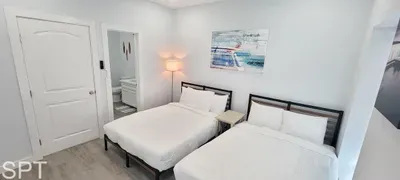 A bright, balanced room where natural light and understated touches shape a peaceful atmosphere. The clean lines and uncluttered layout give the space a steady, welcoming feel, making it an easy place to unwind and feel grounded throughout your stay.