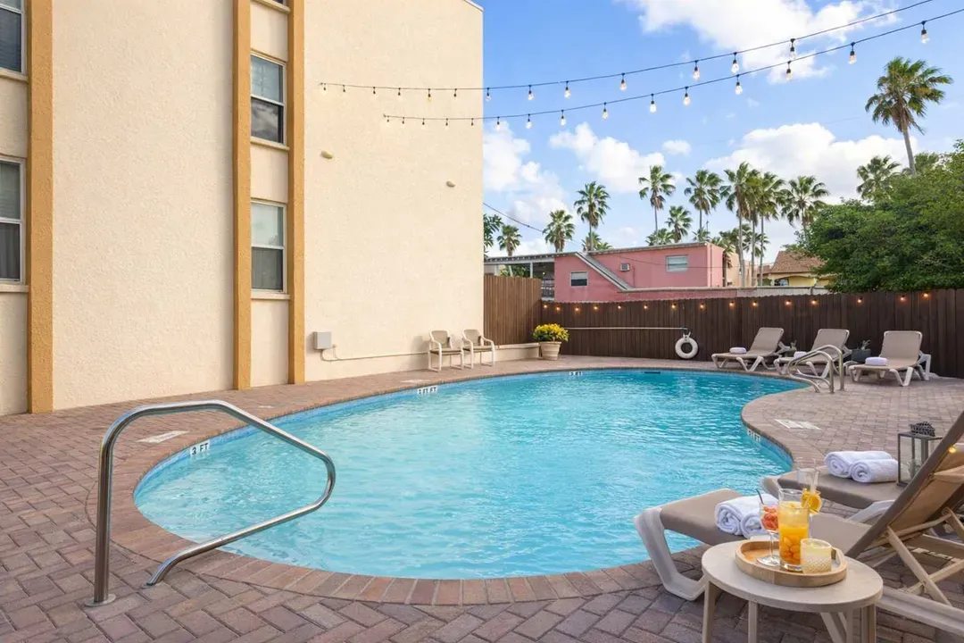 Tropical Pool Retreat | Walk to Beach | Palm Views | Cozy Outdoor Seating | No-Fee Parking