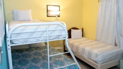 Perfect for families or groups, this cozy bedroom features a twin bed and a bunk bed with a full on bottom and twin on top. Bright and inviting, it offers plenty of sleeping space for kids or friends after a fun day at the beach.